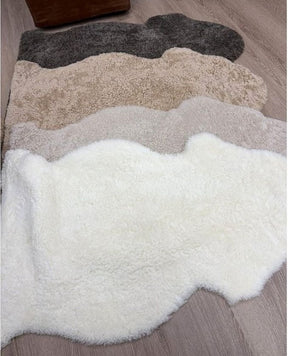 Shearling rug colour collection featuring Natural White, Oatmeal, Honey and Chocolate Fleck shearling rugs.