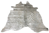 Silver metallic cowhide rug with speckled finish on natural hide displayed as a full rug