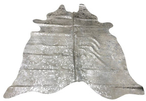 Silver metallic cowhide rug with speckled finish on natural hide displayed as a full rug