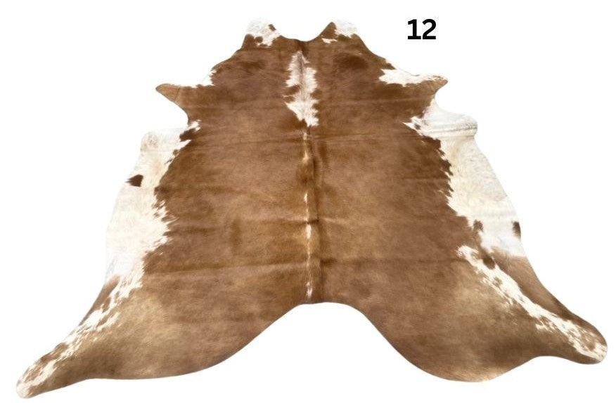 Small brown and white Hereford cowhide rug number 12 with natural markings and central white stripe on a white background