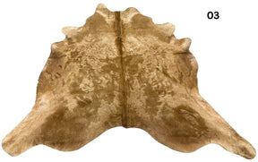 Solid beige cowhide rug number 03 with soft even tones and natural markings on a white background