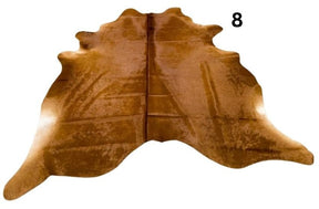 Solid brown cowhide rug number 08 with rich brown tones and natural markings on a white background