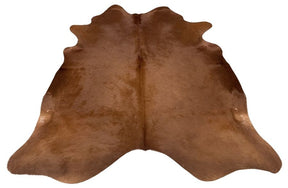 Solid brown cowhide rug example showing rich even tones and natural shape on a white background