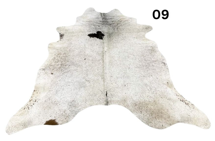 Speckled longhorn cowhide rug number 09 with natural markings and tonal variation on a white background