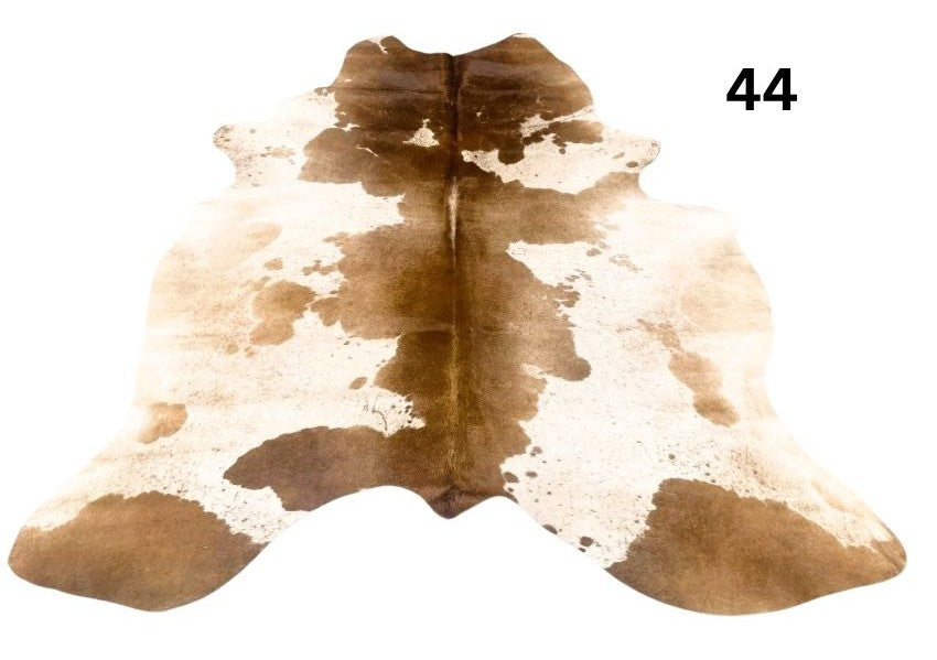 Speckled longhorn cowhide rug number 44 with natural markings and tonal variation on a white background