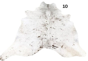 Speckled longhorn cowhide rug small size hide 10 genuine hide with light base and brown speckled markings displayed on white background