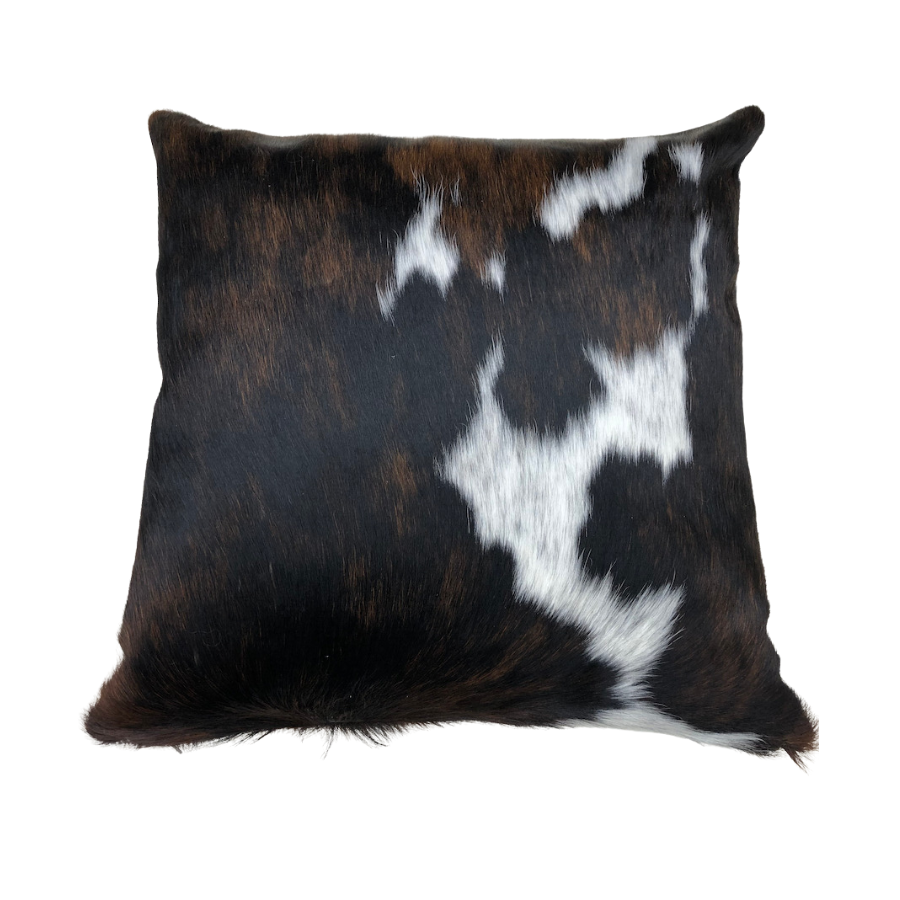 Tri-colour cowhide cushion showing natural hair texture and contrasting tonal pattern