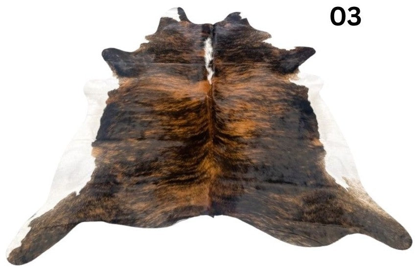 Cowhide rug number 03 with white belly and white spine featuring rich brindle tones and natural markings on a white background