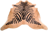 Zebra print cowhide rug in black pattern on natural beige hide displayed as a full rug