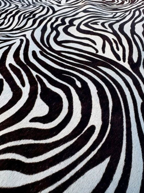 Close-up of zebra print cowhide side showing black pattern on natural hair-on-hide leather
