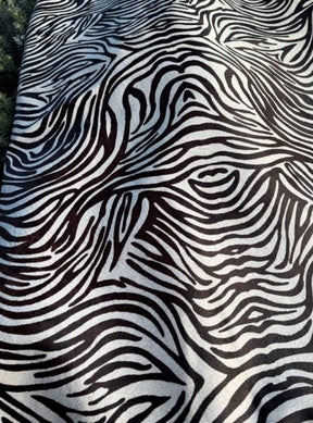 Zebra print cowhide side texture showing black and white pattern on natural hair-on-hide leather
