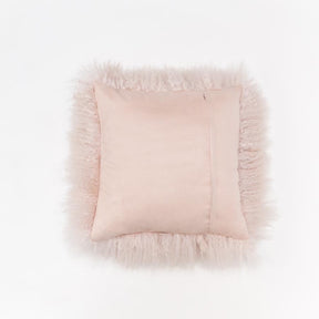 Reverse view of blush Mongolian sheepskin cushion showing smooth cotton velour backing