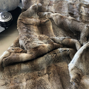 Close-up of brown rabbit hide blanket showing soft natural hair texture