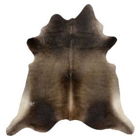 Grey beige cowhide rug example showing natural tonal variation and markings on a white background