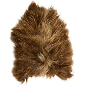 Full Icelandic sheepskin rug in copper with caramel tips photographed on a white background