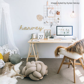 Copper and caramel Icelandic sheepskin rug styled over a chair in a home office interior