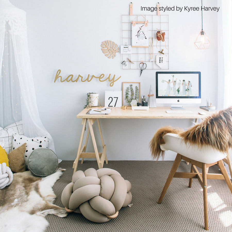 Copper and caramel Icelandic sheepskin rug styled over a chair in a home office interior