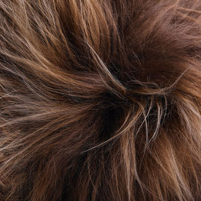 Close-up detail of long wool Icelandic sheepskin rug in copper with caramel tips