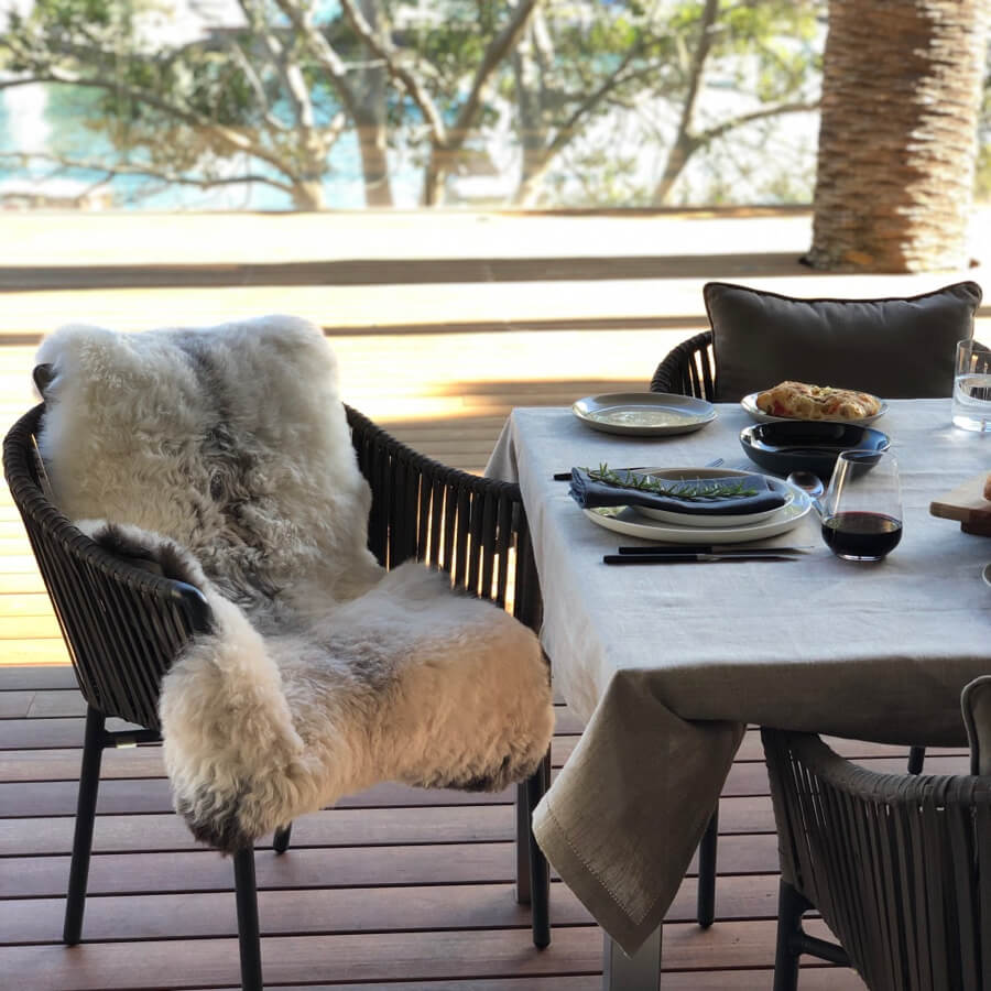 Shorn Icelandic sheepskin rug with dark edged finish styled over a dining chair