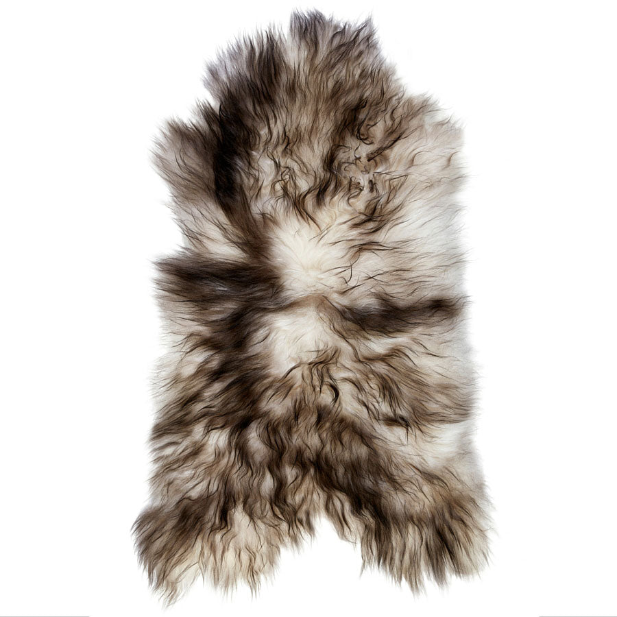 Example of a white Icelandic sheepskin rug with dark tips shown on a white background
