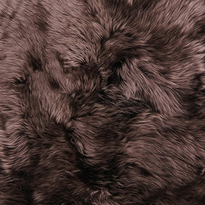 Close up of merino sheepskin rug in a rich chocolate tone showing soft dense wool texture-1