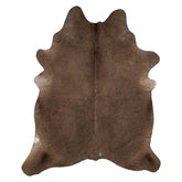 Mocha latte cowhide rug example showing warm brown tones and natural variation on a white background