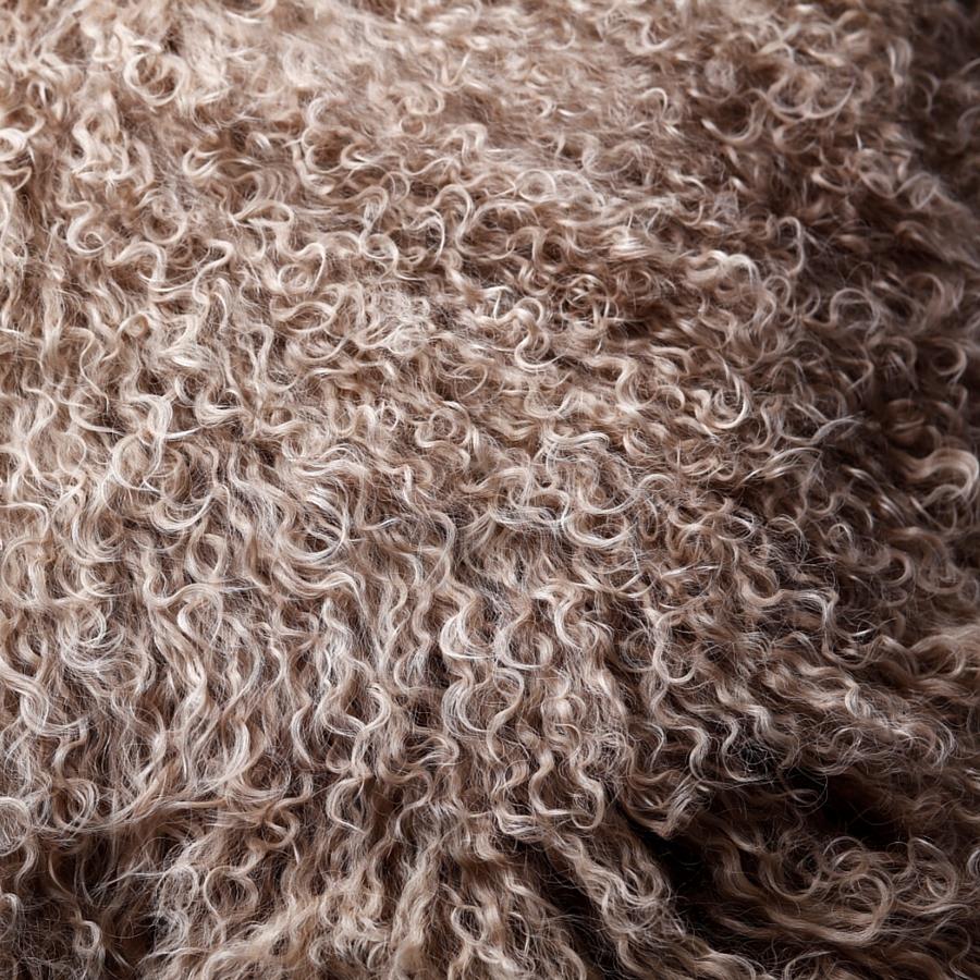Close-up detail of camel Mongolian sheepskin showing soft, silky long wool texture