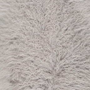 Close-up detail of light grey Mongolian sheepskin showing soft, silky long wool