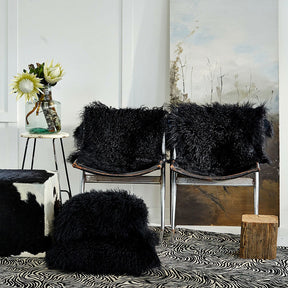 styled black Mongolian sheepskin rugs and cushions in black