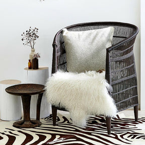 Mongolian sheepskin rug in natural white draped over chair