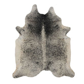 Natural salt and pepper cowhide rug with unique speckled markings photographed flat on a white background