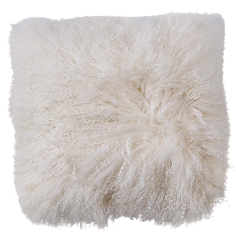 White Mongolian sheepskin cushion with long, soft hair texture photographed flat on a white background